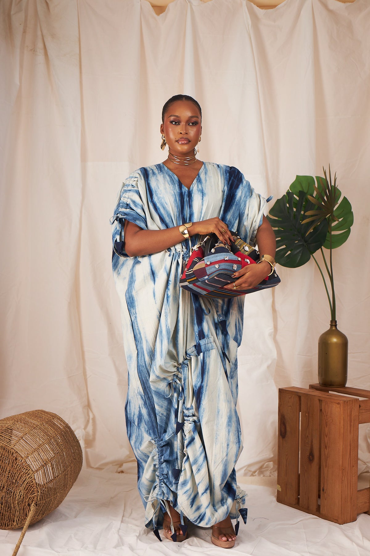 Woman wearing the Eshe indigo drawstring boubou